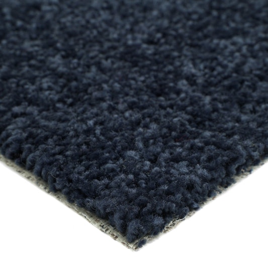Navy blue plush area rug made of soft fabric, perfect for cozy home decor.