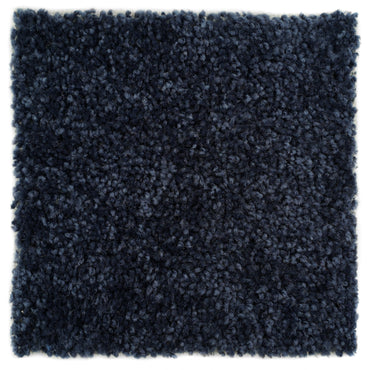 Plush navy blue shag rug made of soft synthetic fibers, perfect for adding warmth and style to any room.