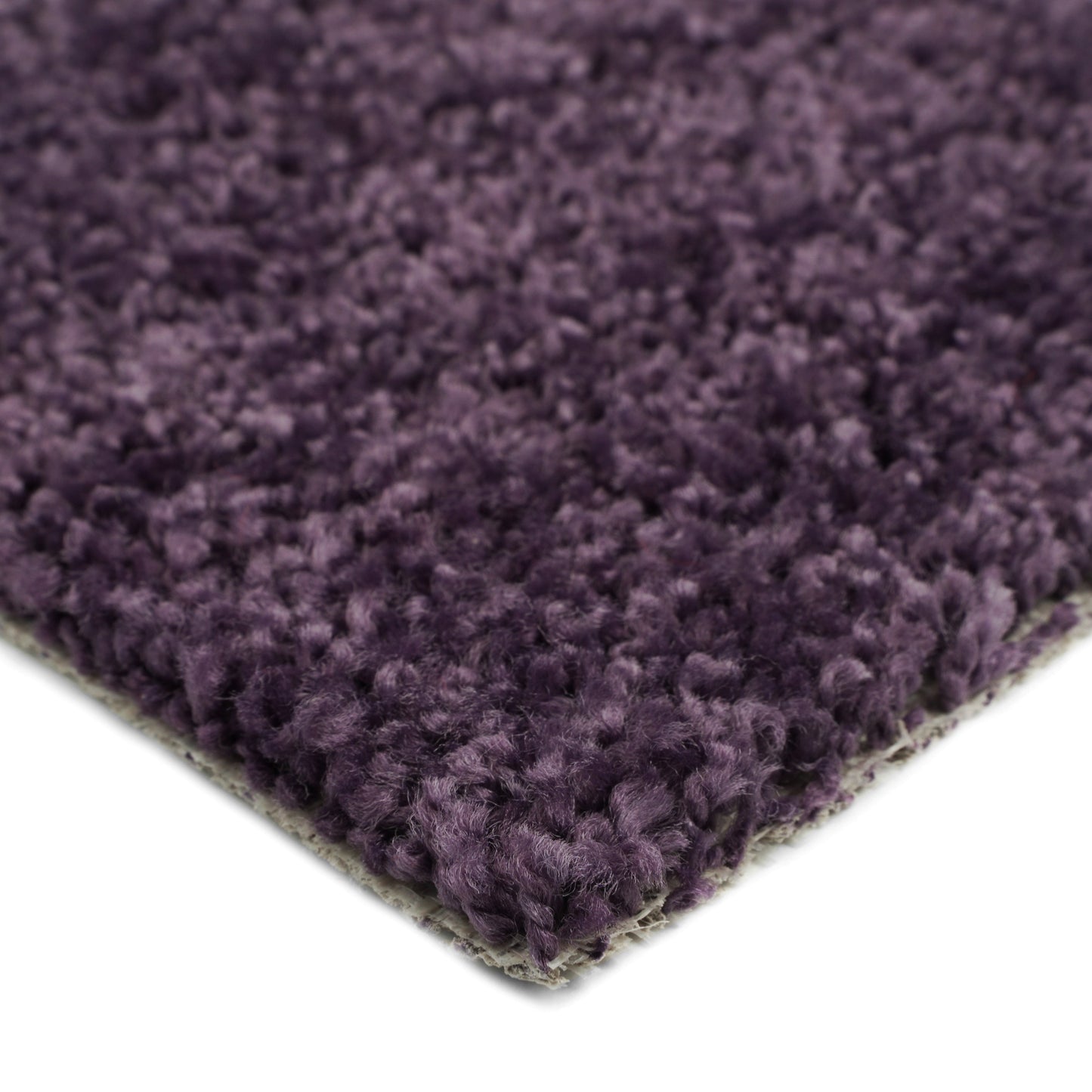 Plush purple area rug, soft synthetic fibers, ideal for cozy home decor and comfort.