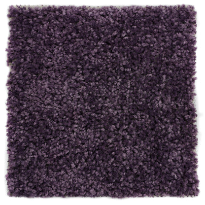 Plush purple shag rug, soft synthetic fibers, perfect for adding warmth to any room décor.