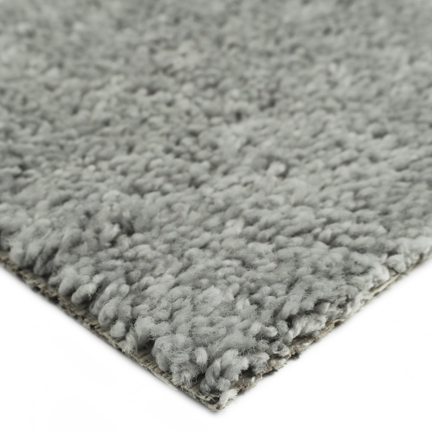 Soft gray shag area rug, dense pile, cozy texture, ideal for living rooms or bedrooms.
