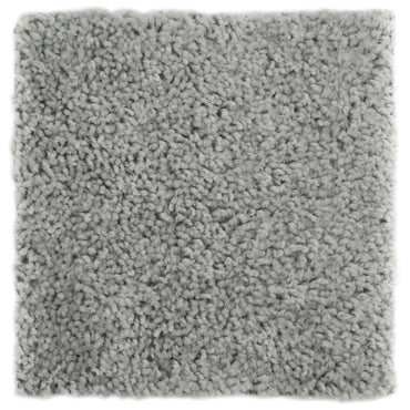 Soft gray plush area rug made of cozy shag material, perfect for adding warmth to any space.