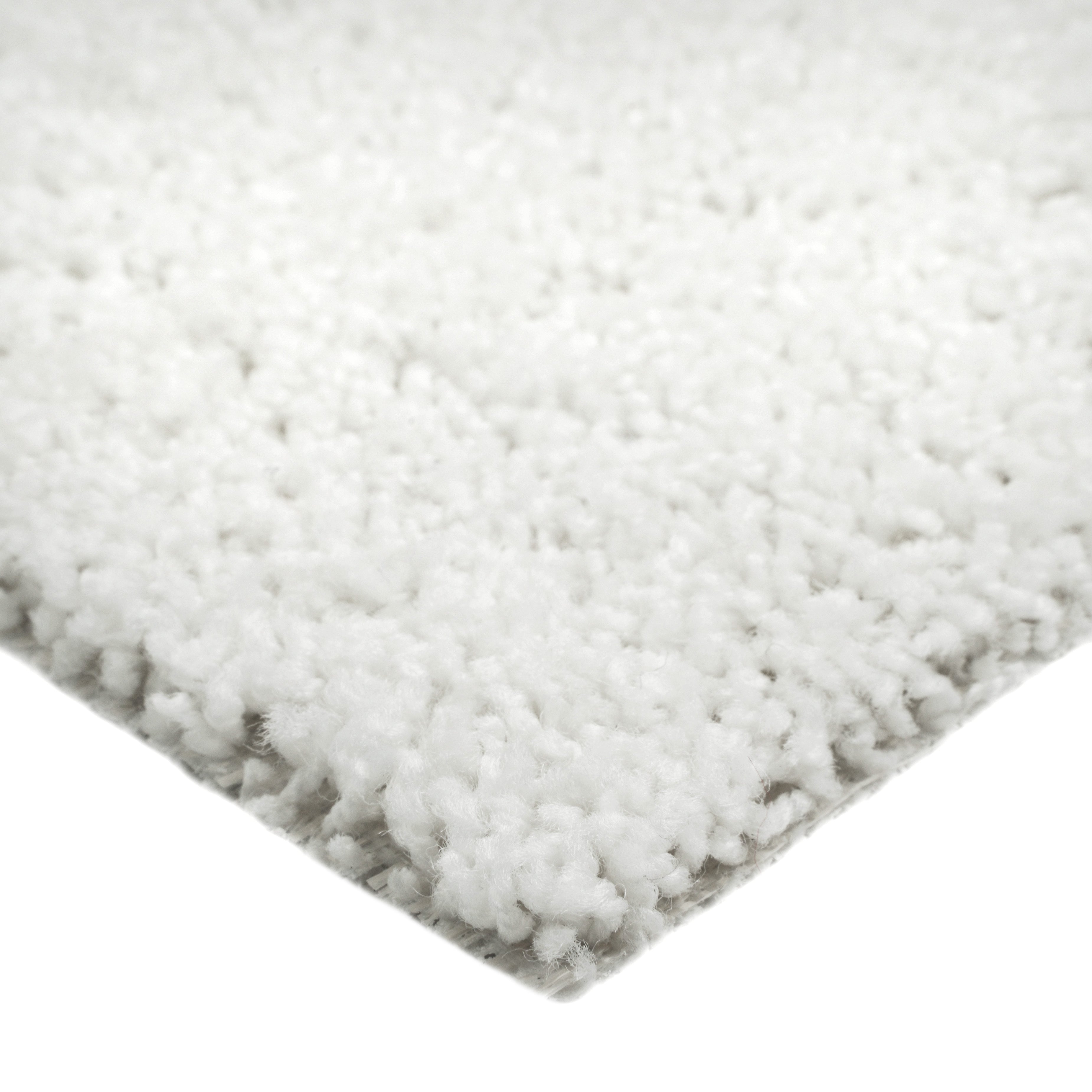 Cozy white shag area rug, soft texture, perfect for living room decor or bedroom comfort.