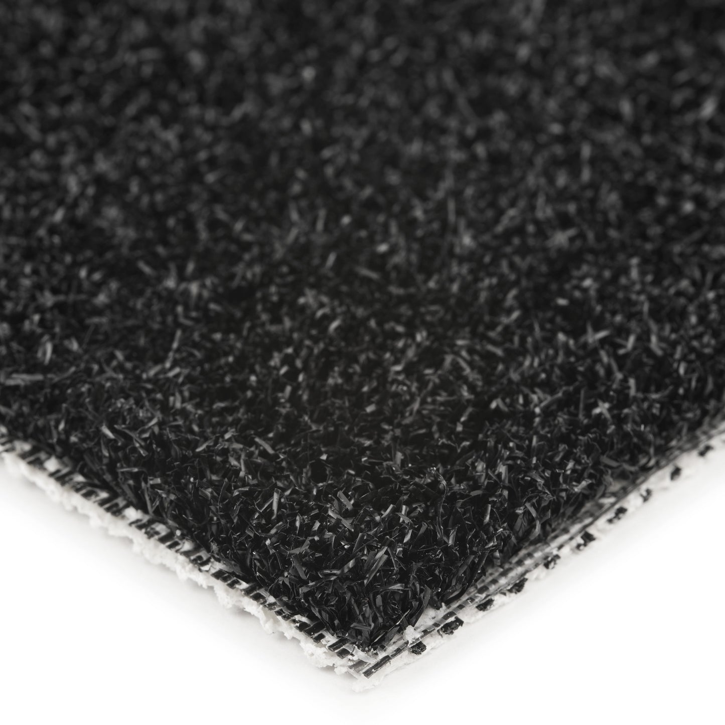 Close-up of a black synthetic turf mat with textured surface for outdoor use.