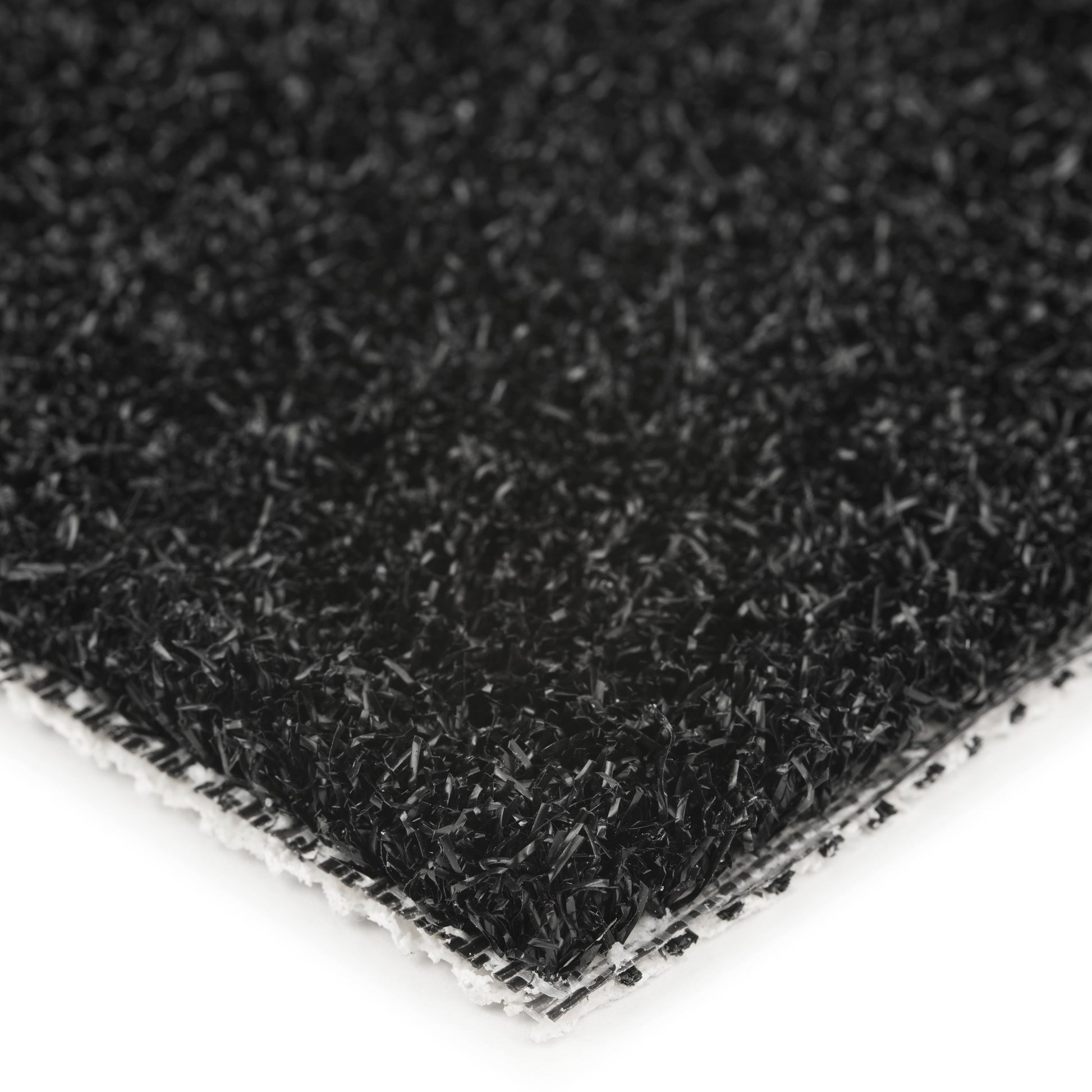 Close-up of a black synthetic turf mat with textured surface for outdoor use.