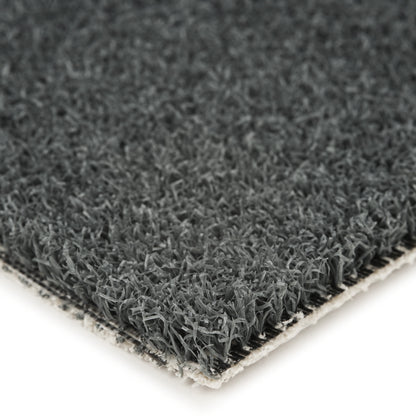 Dark gray artificial grass mat with textured surface, ideal for landscaping or indoor decor.