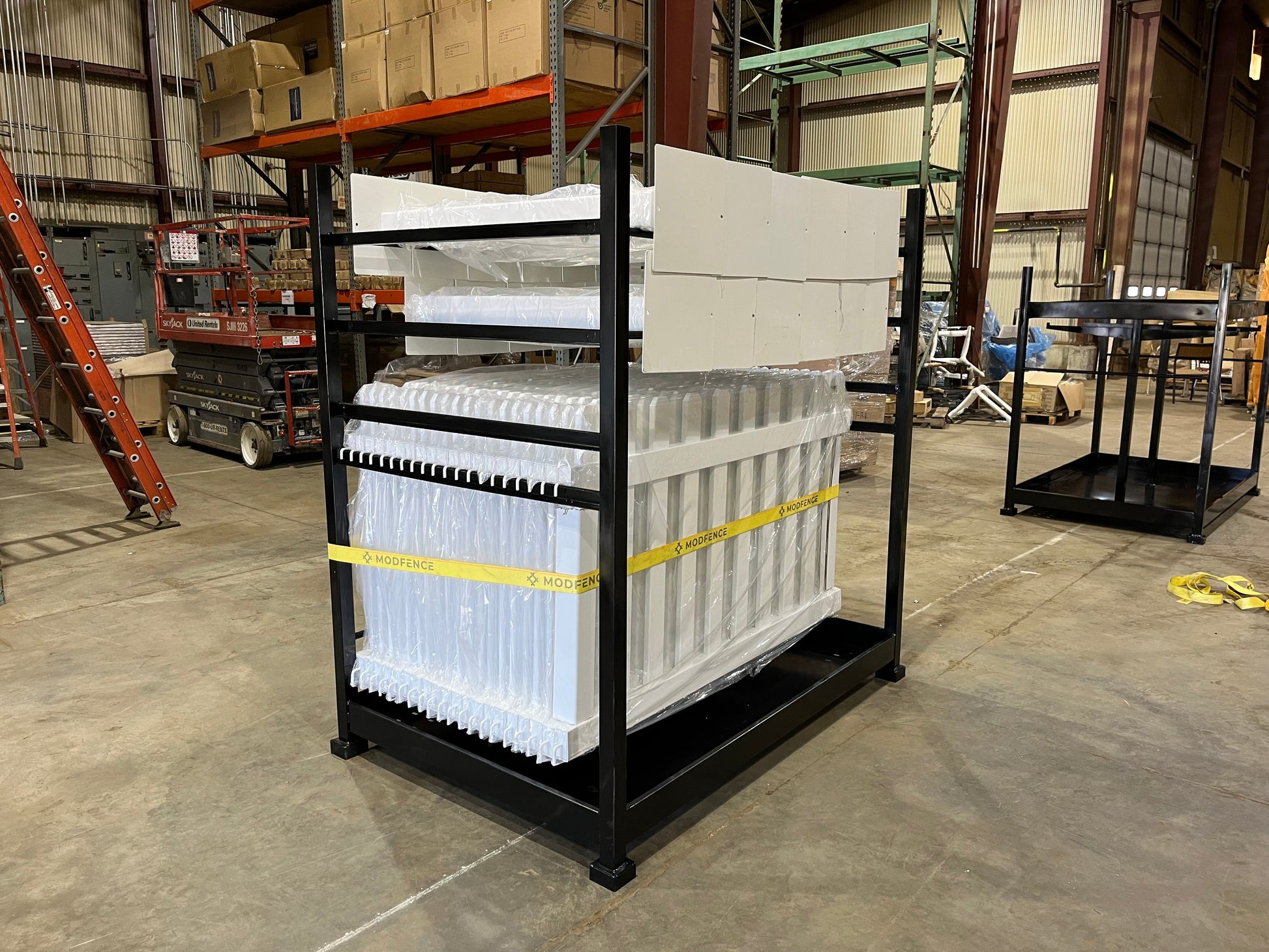 Heavy-duty black metal display rack with white plastic panels, ideal for storage and organization.