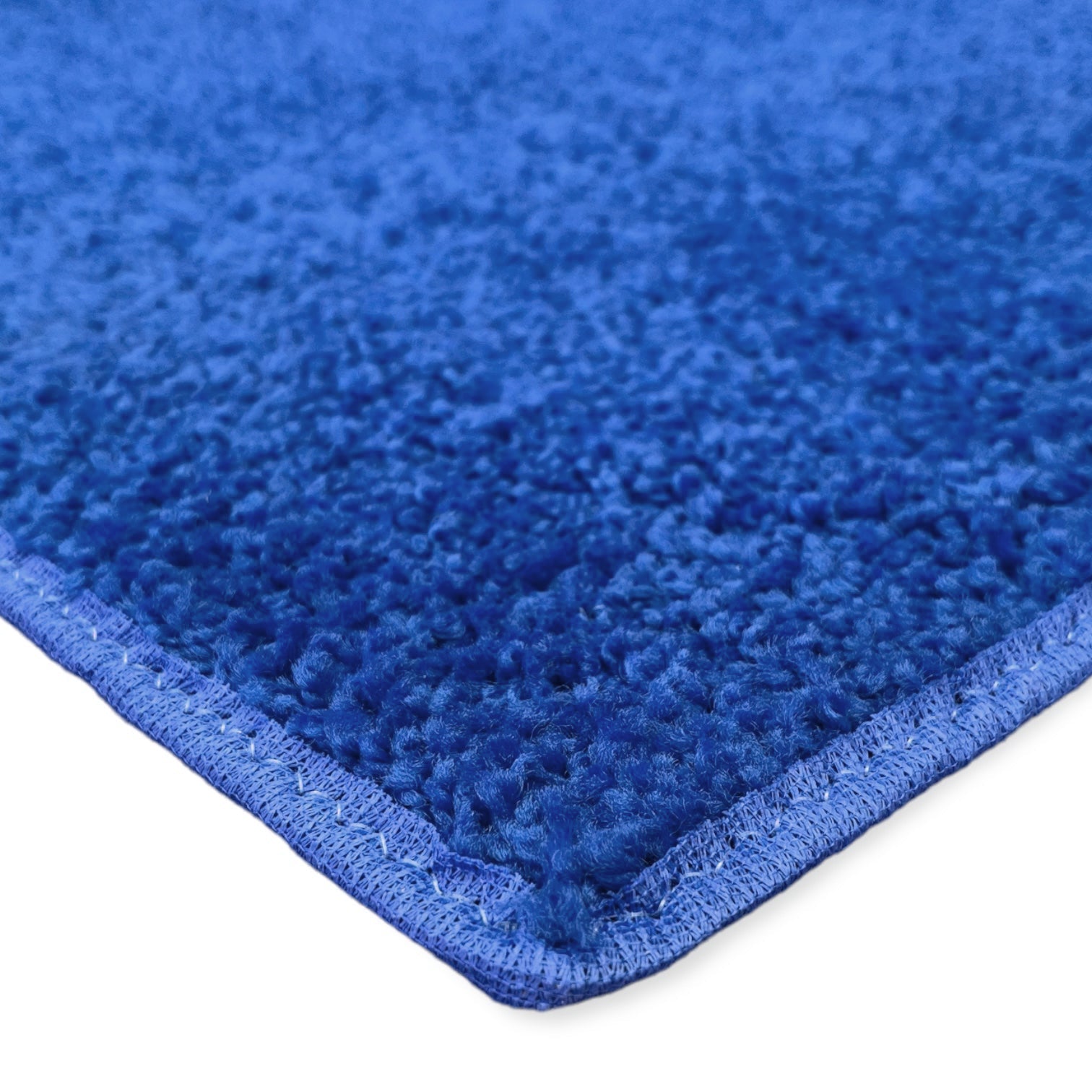 Soft blue plush rug with durable edges, perfect for cozy home decor.