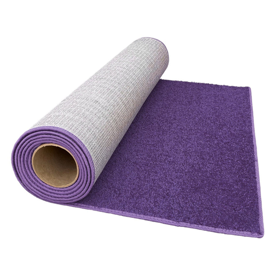 Purple soft area rug with a textured backing, perfect for adding color and comfort to any space.