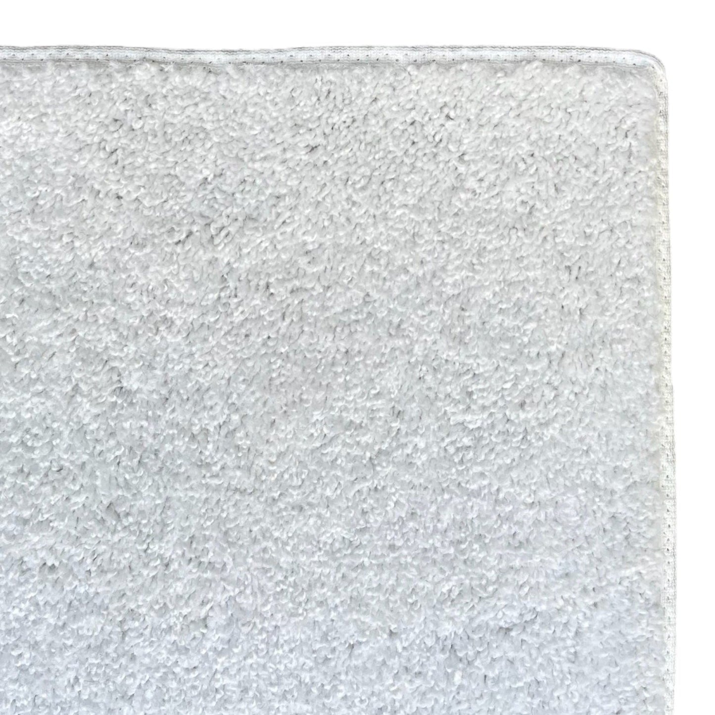 Soft gray cotton bath mat, super absorbent, ideal for stylish bathroom decor.